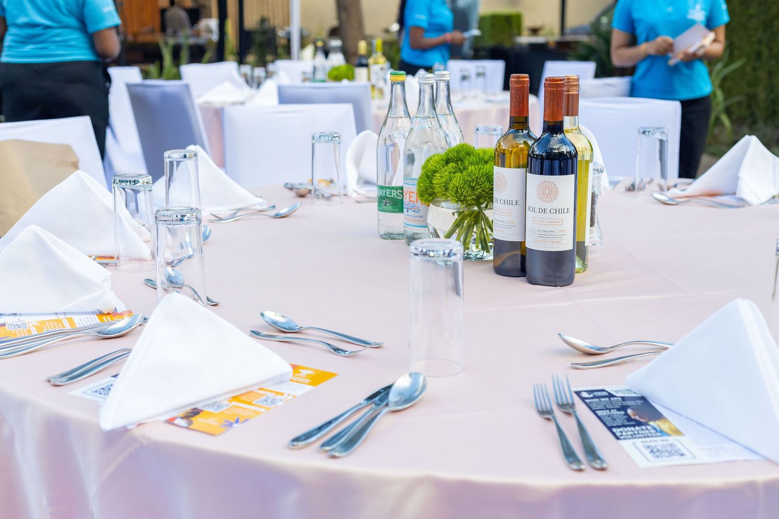 Table setting with wine and folded napkins