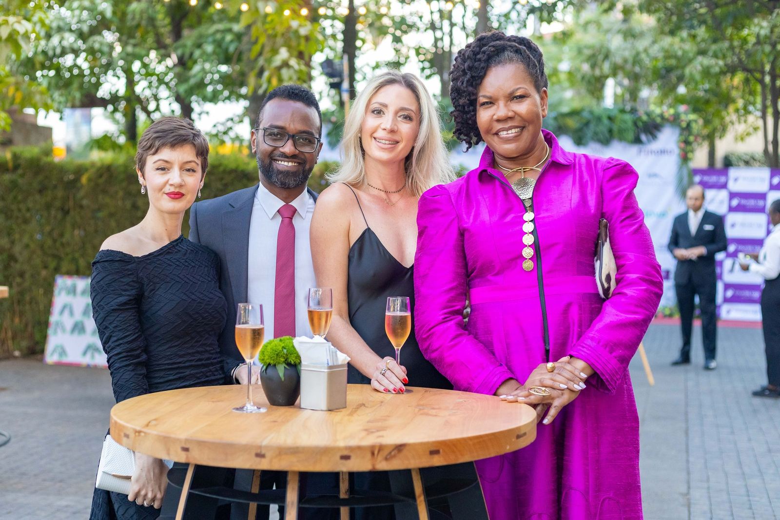 Four guests with sparkling wine at the welcome reception