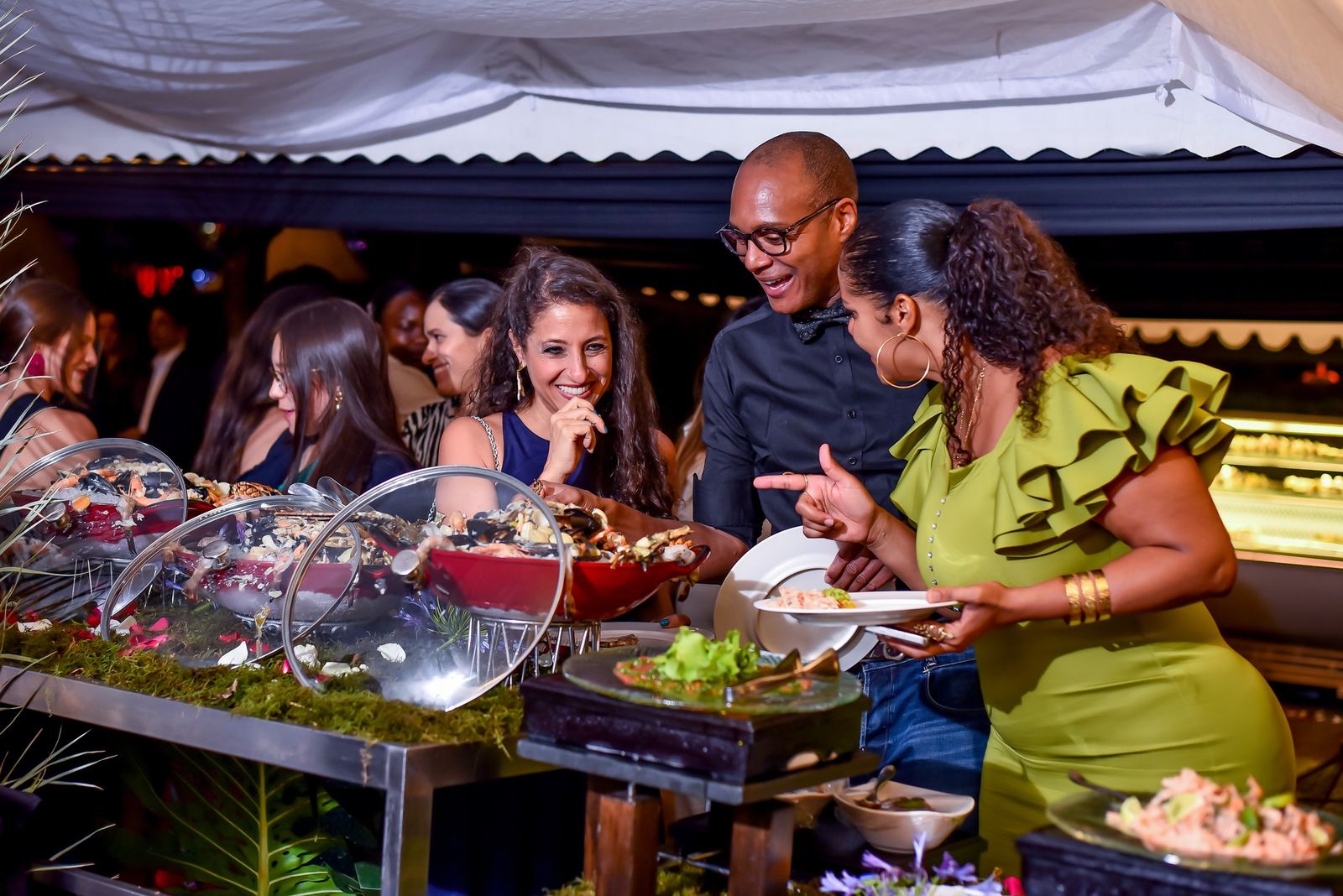 Guests laughing at the buffet