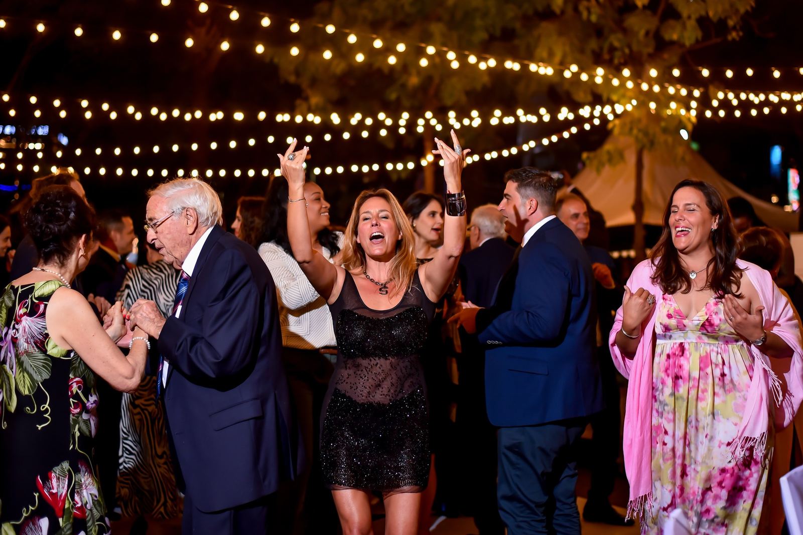 Guests of all ages dancing together